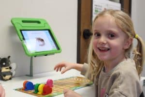 Child in pediatric speech therapy at Connect the Dots