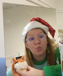 SLP Sarah Young practicing speech sounds with little toy hamster